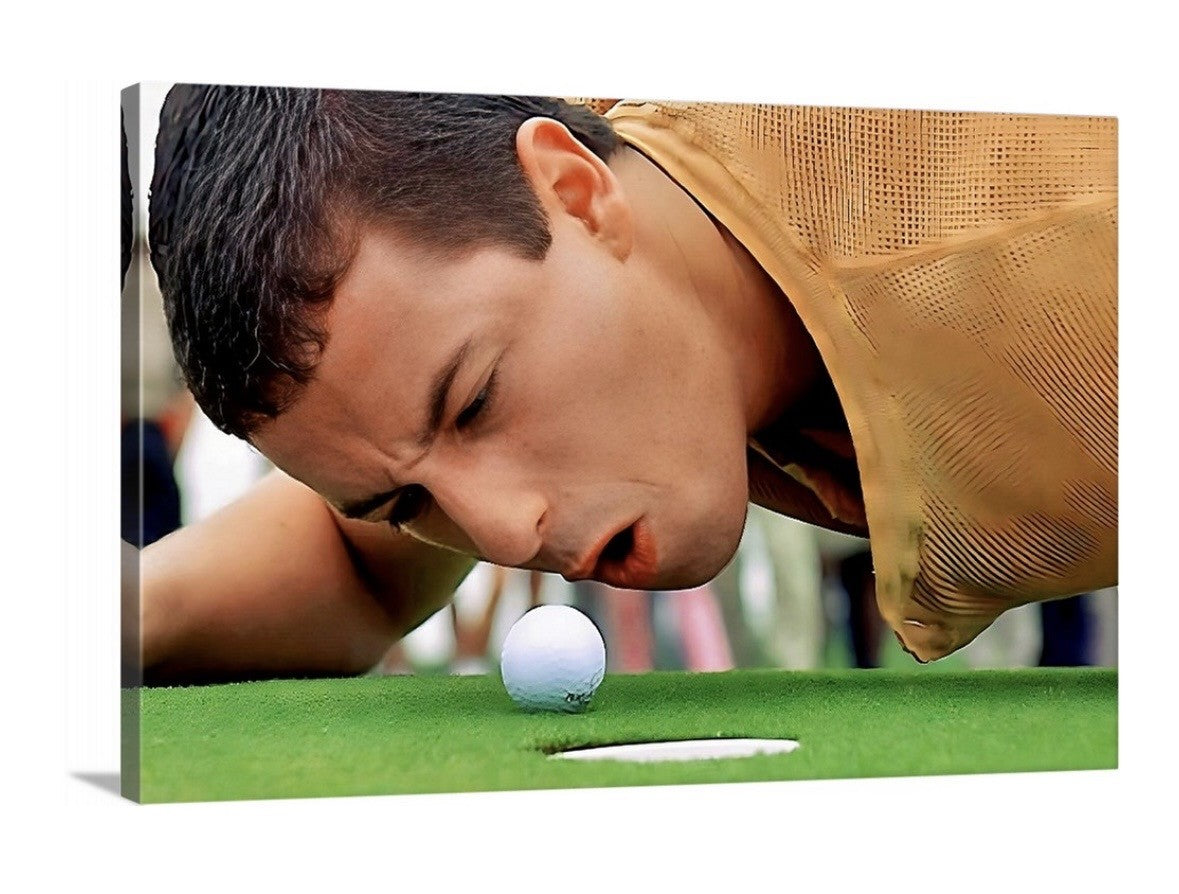 Man blowing on a golf ball near a hole on a green